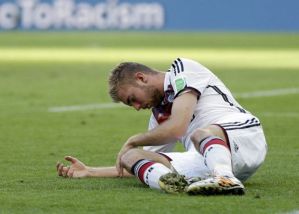  Germany's Christoph Kramer lies on the pitch after getting hit in the face by Argentina's Ezequiel Garay's shoulder during the World Cup final soccer match between Germany and Argentina at the Maracana Stadium in Rio de Janeiro, Brazil, Sunday, July 13, 2014. (AP Photo/Natacha Pisarenko) ORG XMIT: WCDP124 (Natacha Pisarenko)
